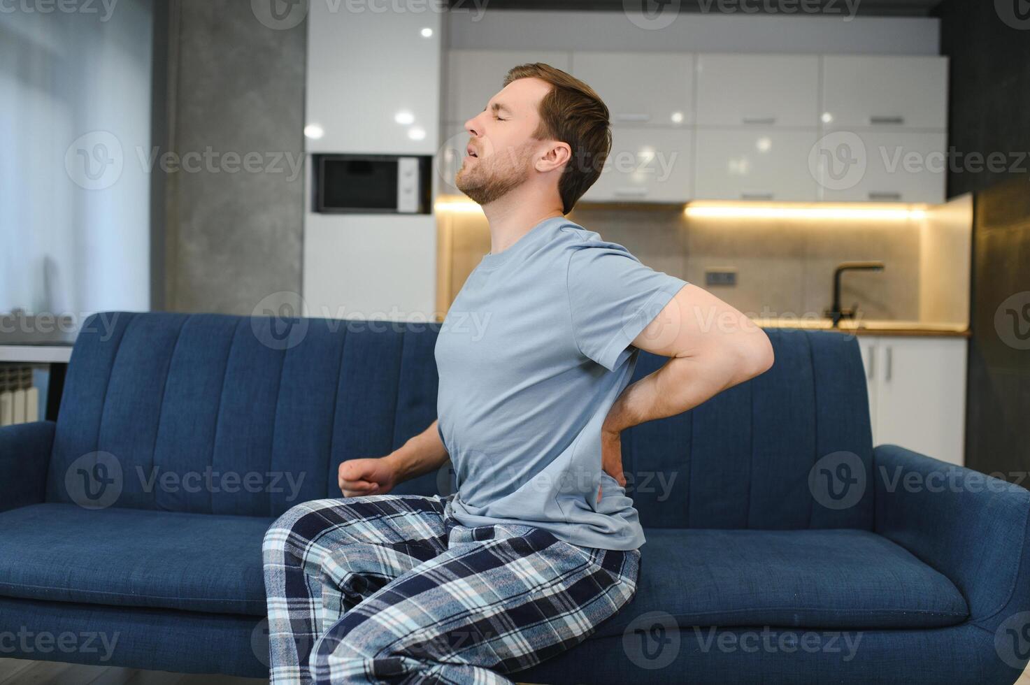 Man suffering from back pain photo