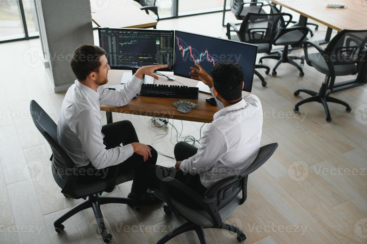 Two diverse crypto traders brokers stock exchange market investors discussing trading charts research reports growth using pc computer looking at screen analyzing invest strategy, financial risks. photo