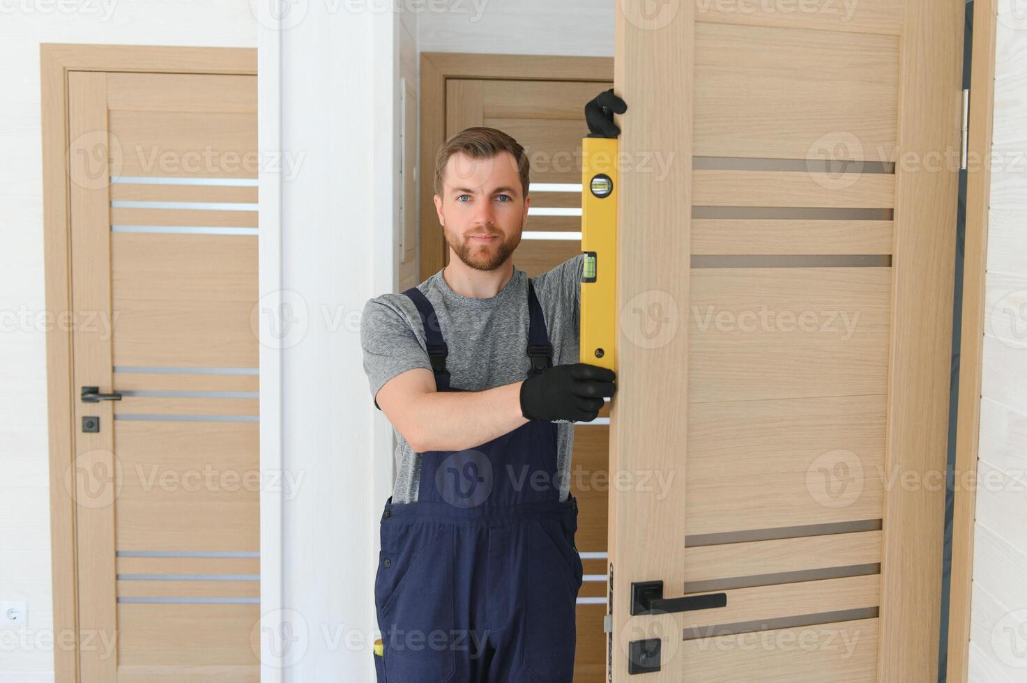 Process of construction new and modern modular house from composite sip panels. Worker man in special protective uniform wear working on building development industry of energy efficient property. photo