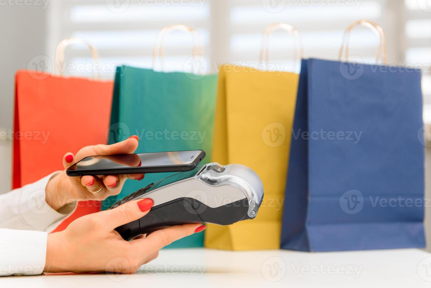 paying through smartphone using NFC technology. payment by phone through the terminal photo
