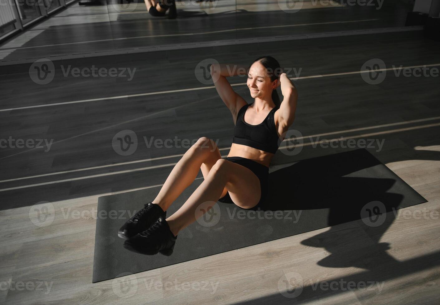 beautiful athletic woman working ab intervals in fitness photo