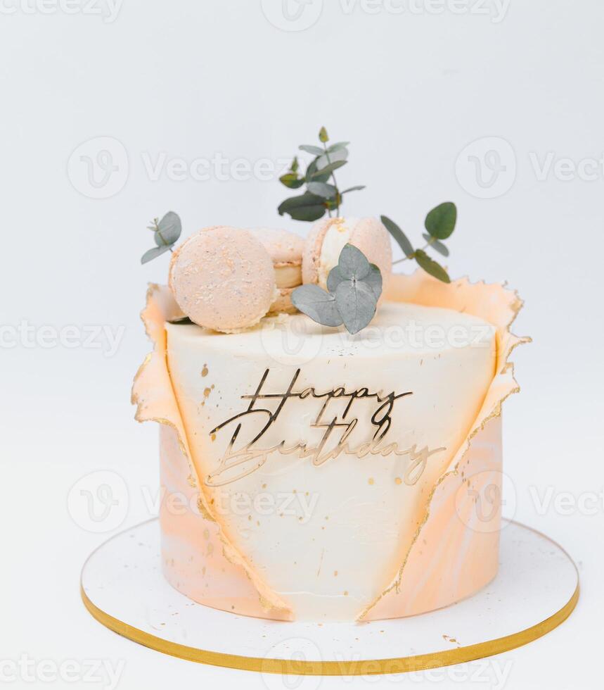Colorful birthday cake with golden happy birthday banner photo