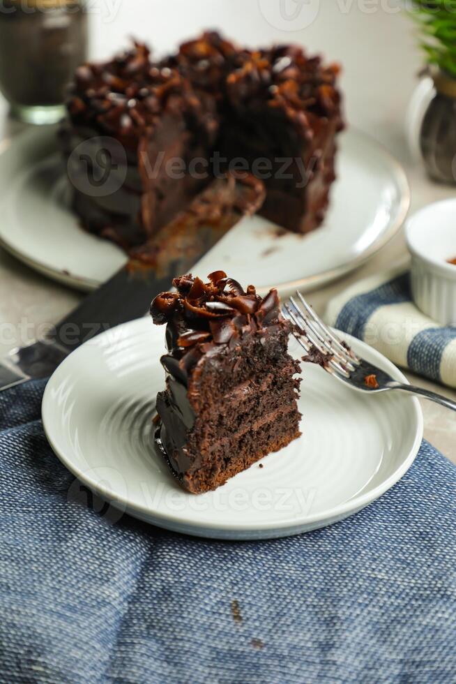 Chocolate Fudge Cake with fork and knife served in plate on food table top view cafe bake dessert photo