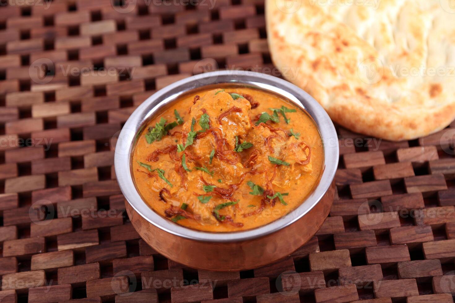 Mughlai Chicken Lamb Curry with bread served in dish isolated on table side view of middle east food photo