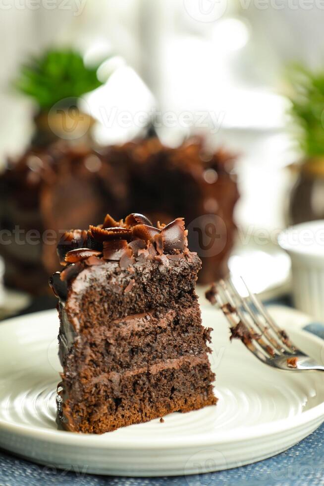 Chocolate Fudge Cake with fork and knife served in plate on food table top view cafe bake dessert photo