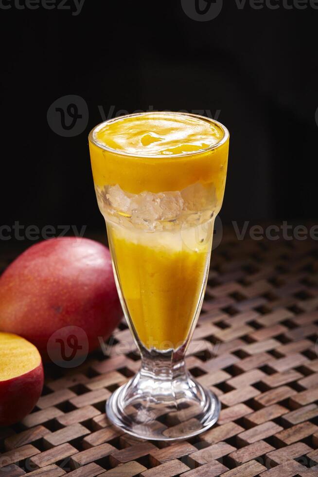 Sparkling Mango soda cocktail served in glass isolated on table side view of middle east food photo