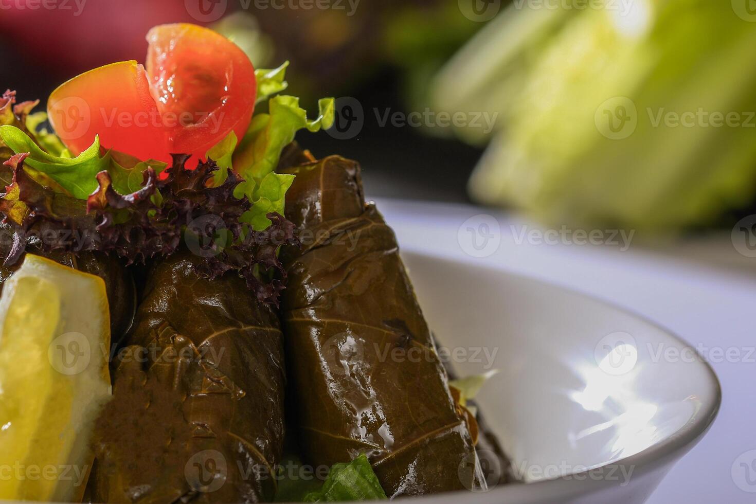 VINE LEAVES wraps served in dish closeup side view of arab food photo
