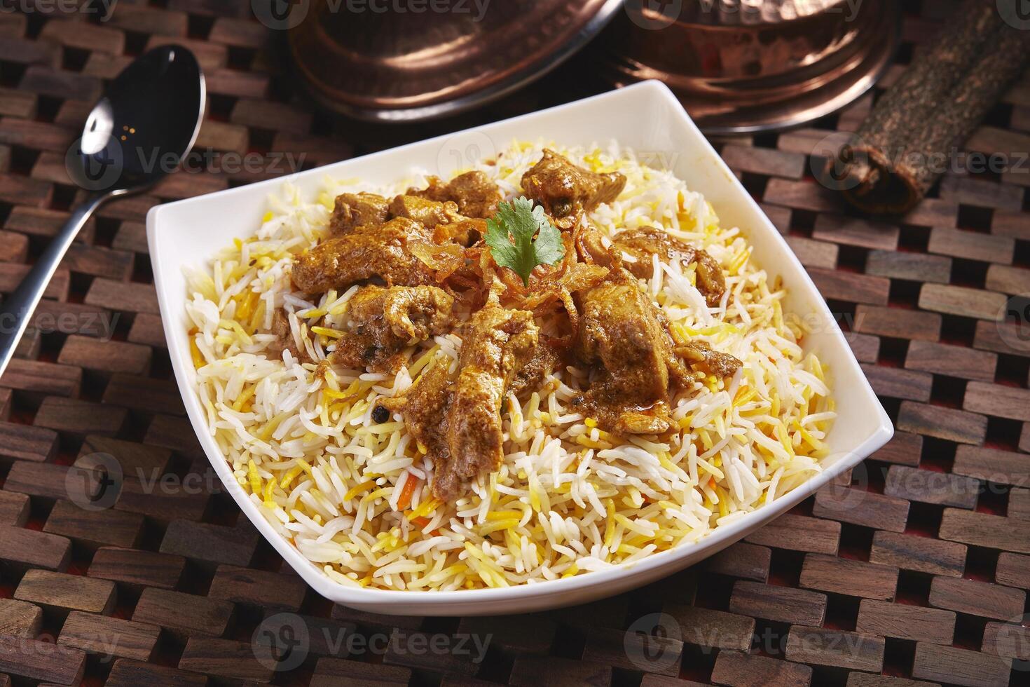 Chicken, Lamb and mutton Biryani served in dish isolated on table side view of middle east food photo