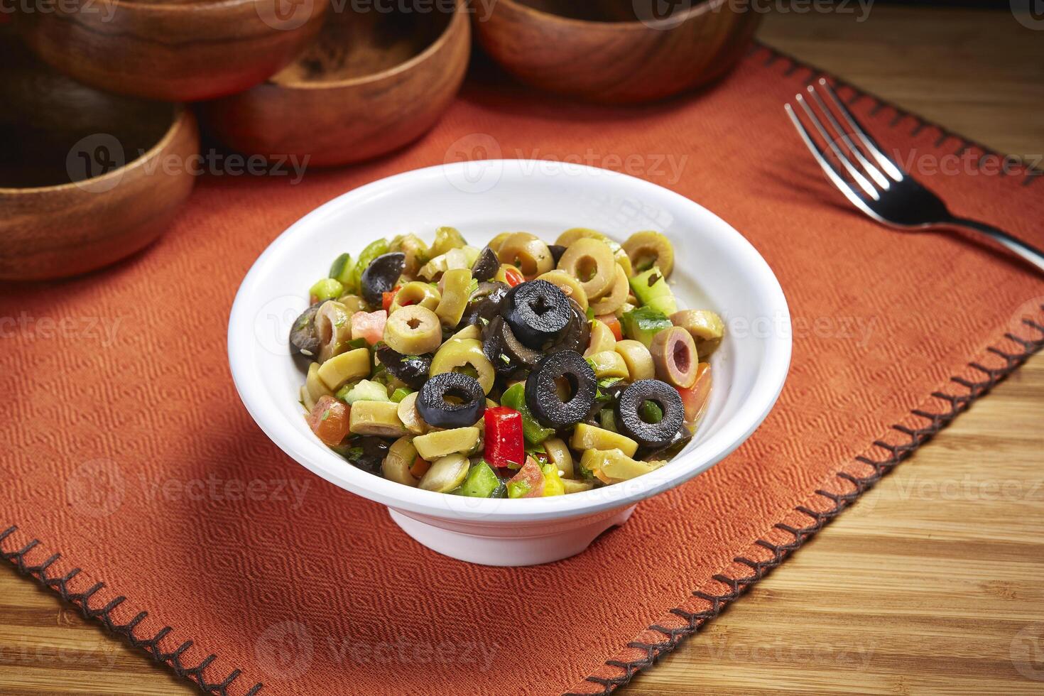 Fresh health Olive Salad with cucumber, tomato served in dish isolated on table side view of middle east food photo