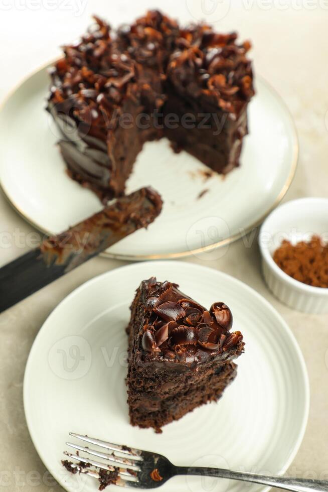 Chocolate Fudge Cake with fork and knife served in plate on food table top view cafe bake dessert photo