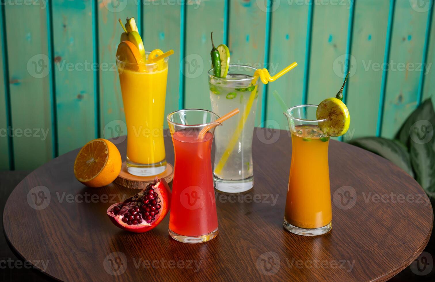 Assorted juices soda, cumin seeds water, watermelon juice shake with Spicy Lemonade, raw watermelon, straw isolated on wooden table side view healthy drink for vitamin c photo