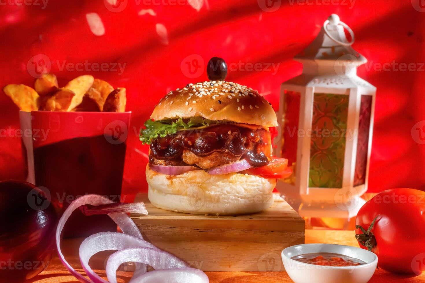 BBQ chicken cheese burger with french fries, potato and tomato slice isolated on wooden board side view on table fast food photo