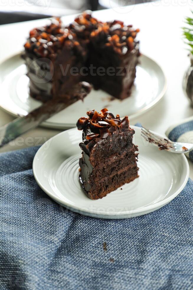 Chocolate Fudge Cake with fork and knife served in plate on food table top view cafe bake dessert photo