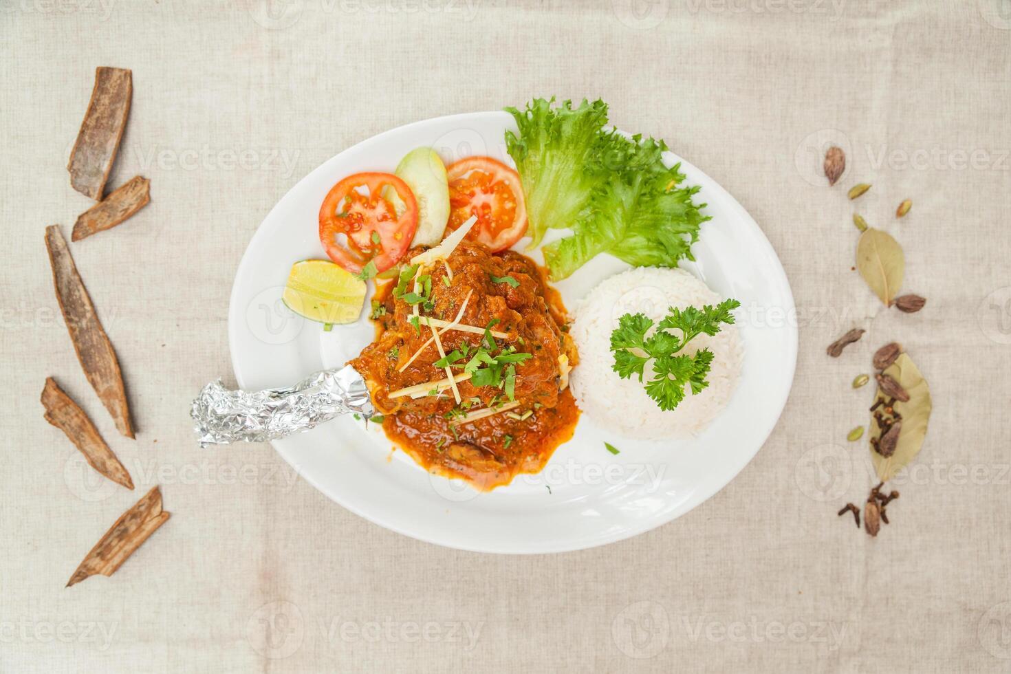 Mutton Raan masala with gravy and salad served in a dish isolated on table top view of indian spices food photo