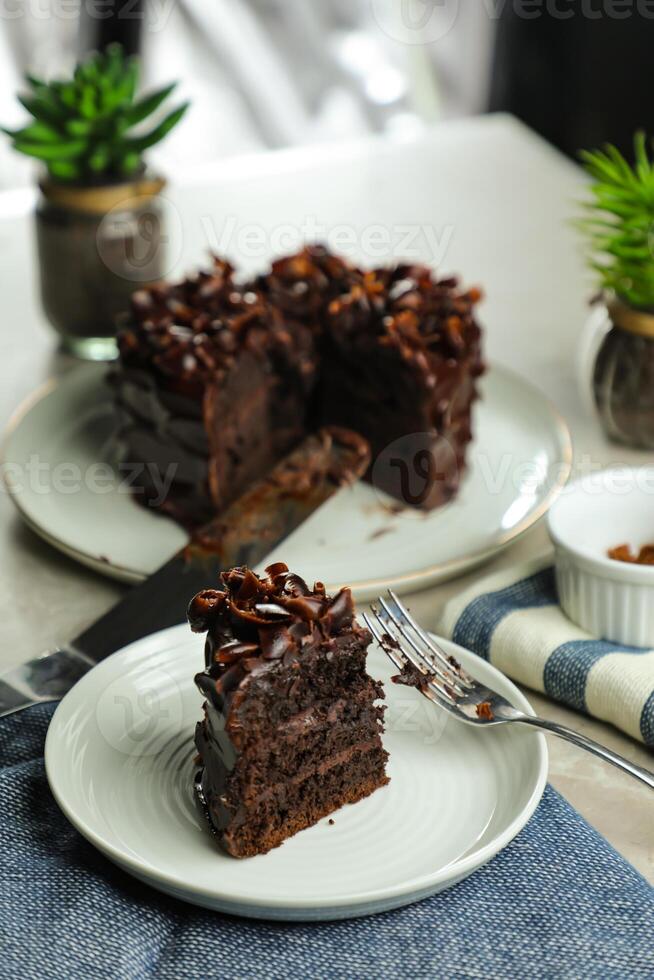 Chocolate Fudge Cake with fork and knife served in plate on food table top view cafe bake dessert photo