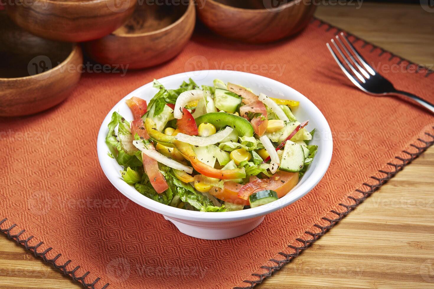 Marmaris Mixed Salad with cucumber. corn, tomato and green leaves served in dish isolated on table side view of middle east food photo