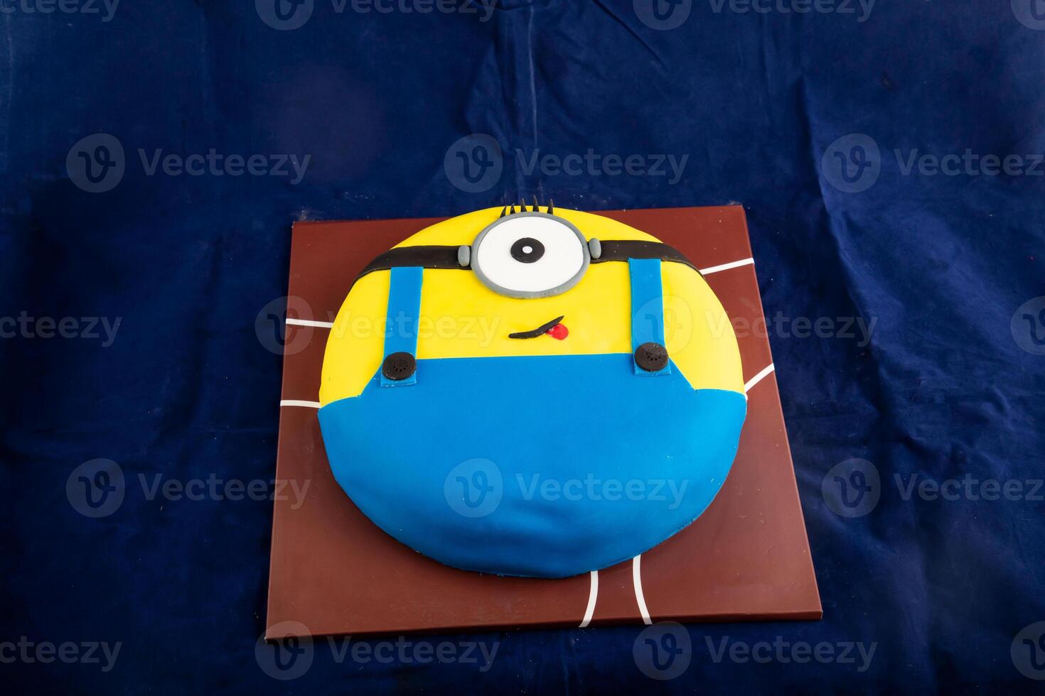 Minion Cake served on board isolated on napkin side view of cafe baked food photo