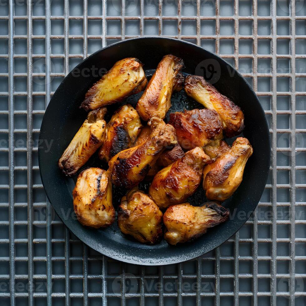 AI generated Grilled Chicken Wings Appetizing Display on Metal Grid Background For Social Media Post Size photo