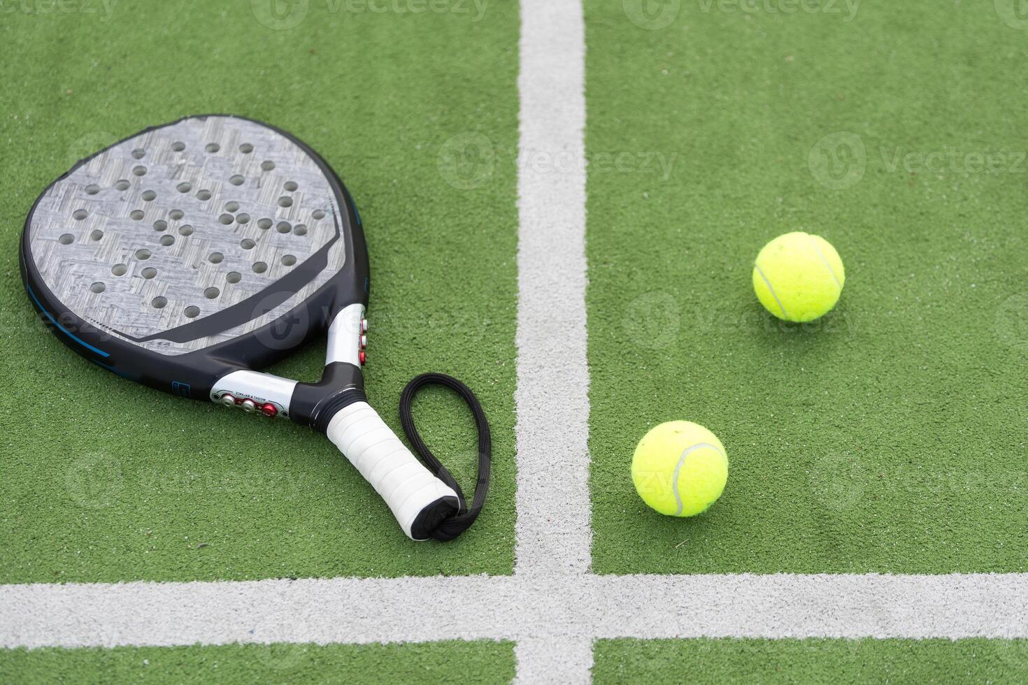 paleta tenis raqueta y pelota foto