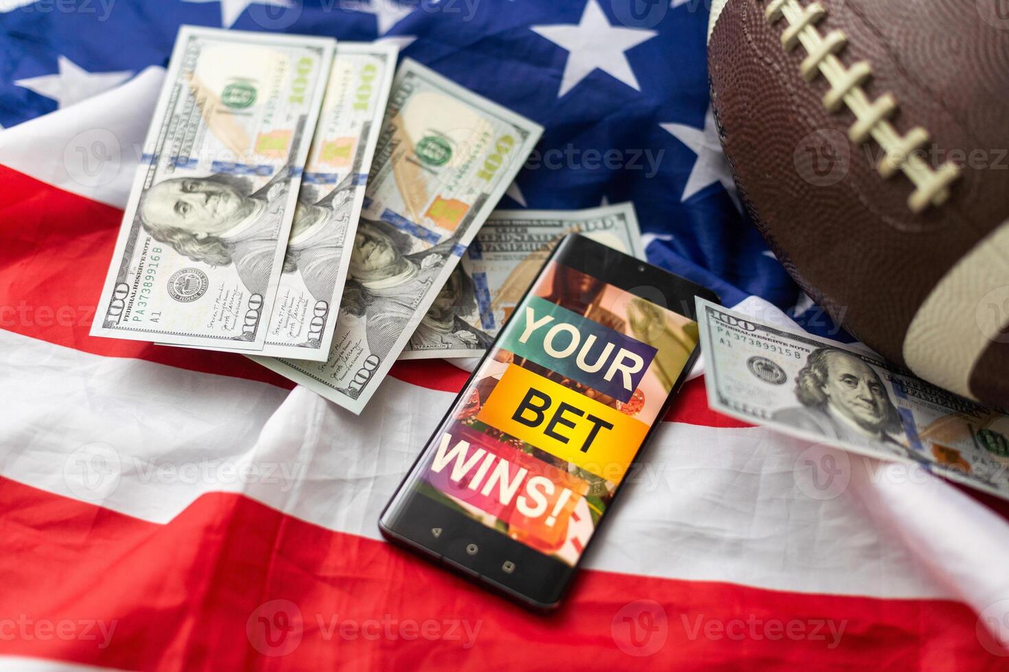 rugby ball and dollars with usa flag and smartphone bet photo