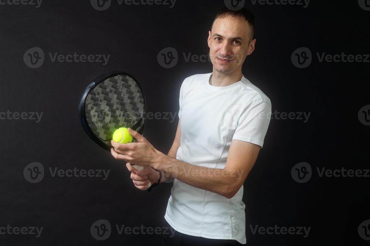 one caucasian mature man Paddle Padel tennis player shadow silhouette in studio isolated on black background photo