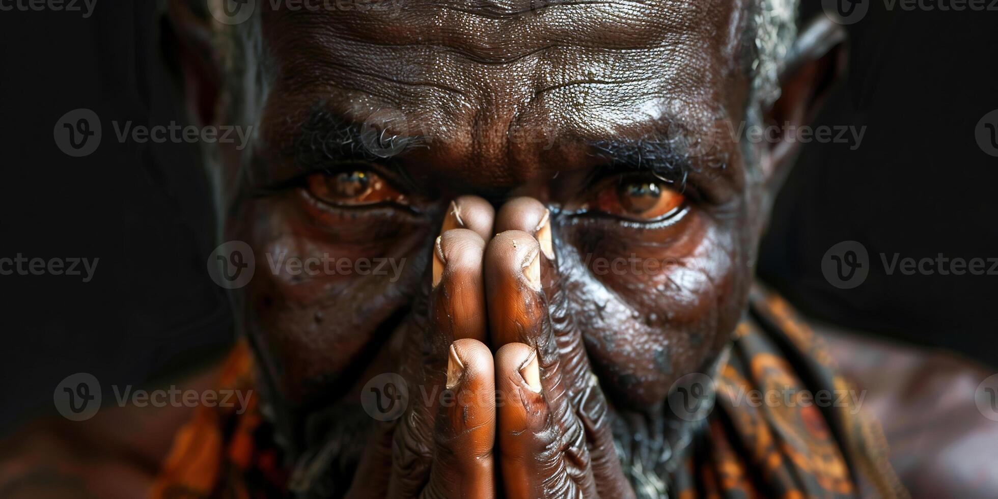 AI Generated praying to god with hands together Caribbean man praying with black background stock photo