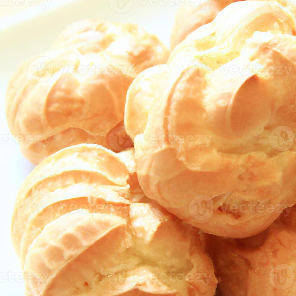 AI generated Eclair is a traditional french crispy dessert with buttercream. AI generated. photo