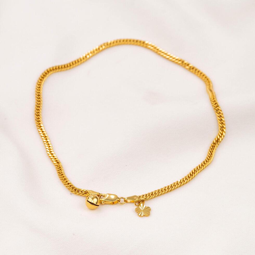 gold bracelet jewelry with two bells photo