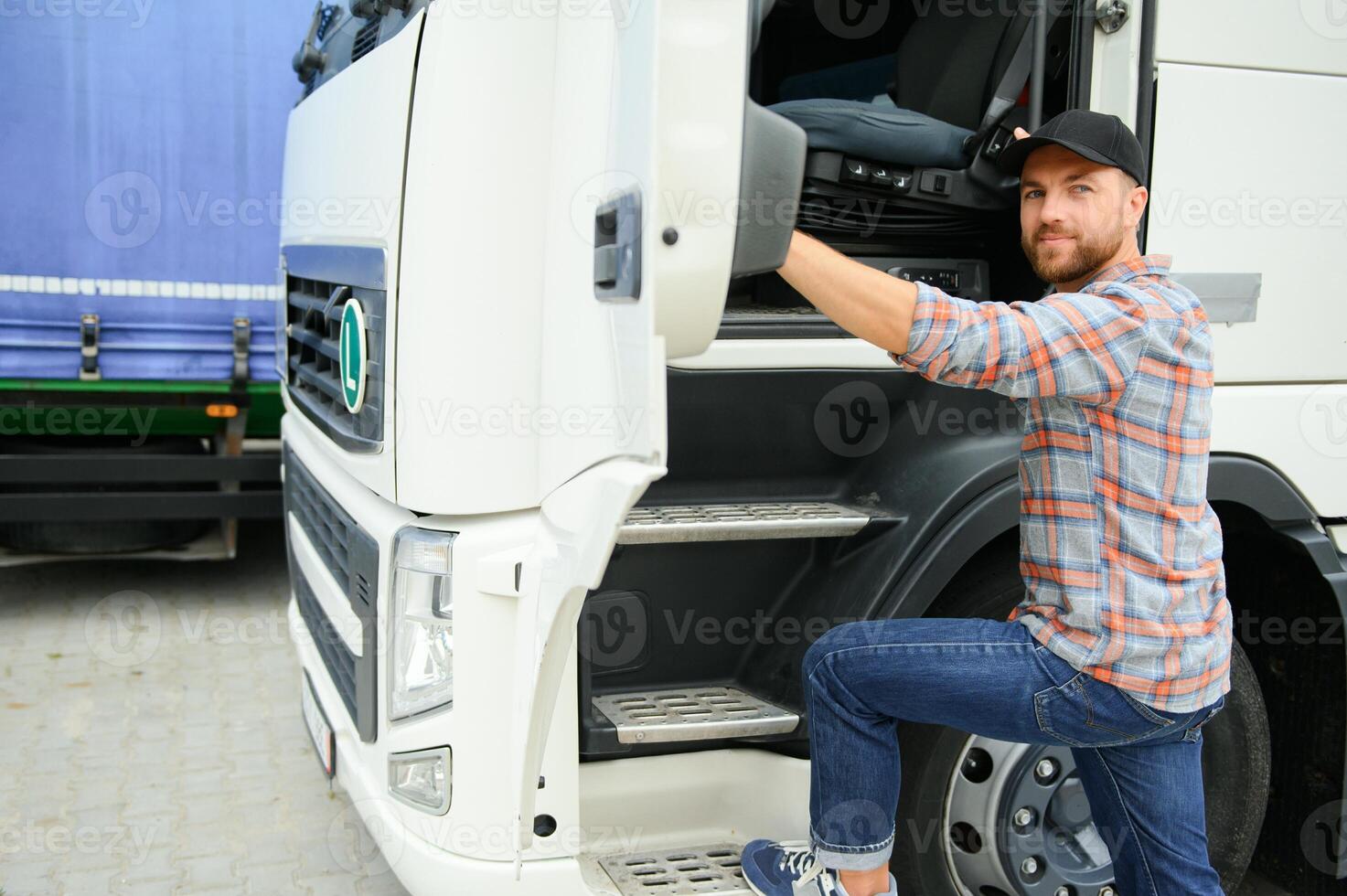 Caucasian Male Truck Driver Stepping Out Of Vehicle At Rest Stop. photo