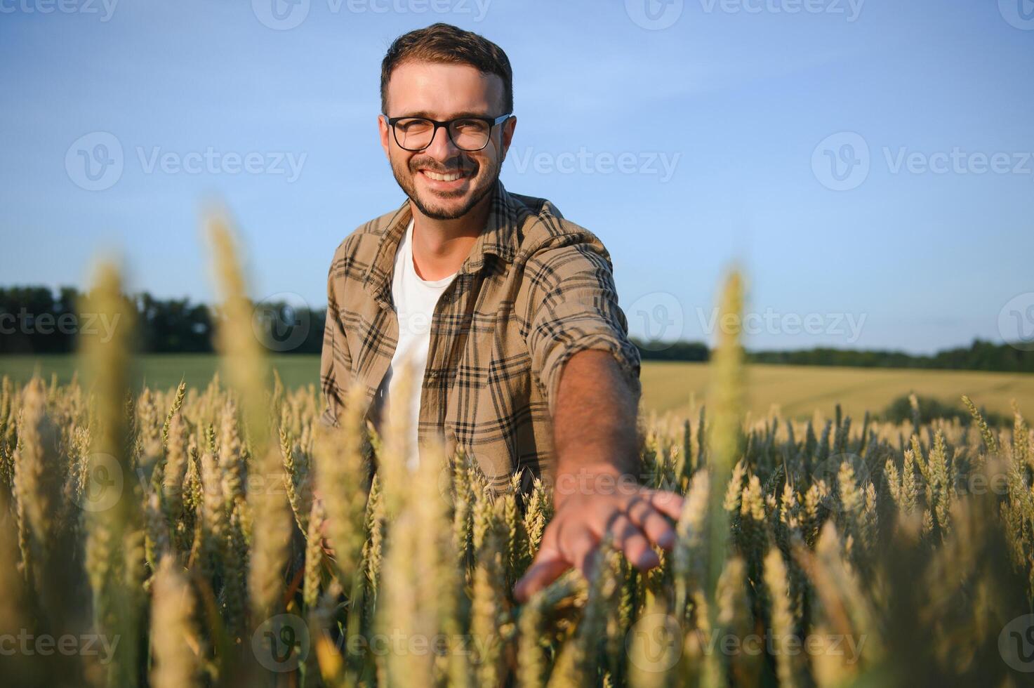 Portrait of farmer in wheat field photo