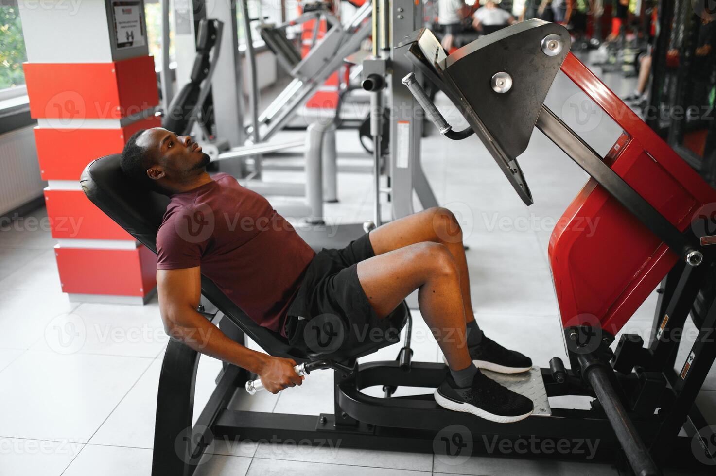Young athletic African American man in the gym photo