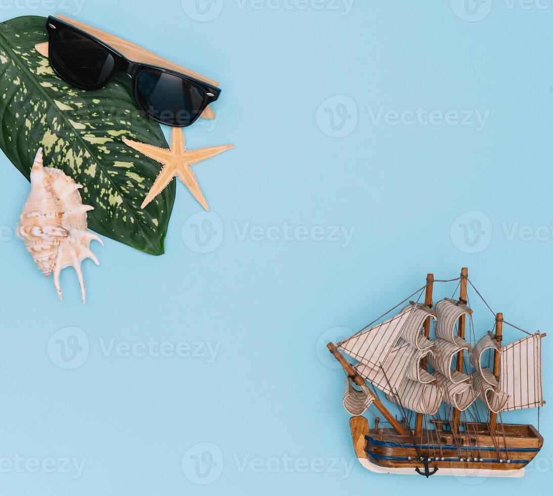 Travel accessories on blue background, travel concept. Top view with copy space photo