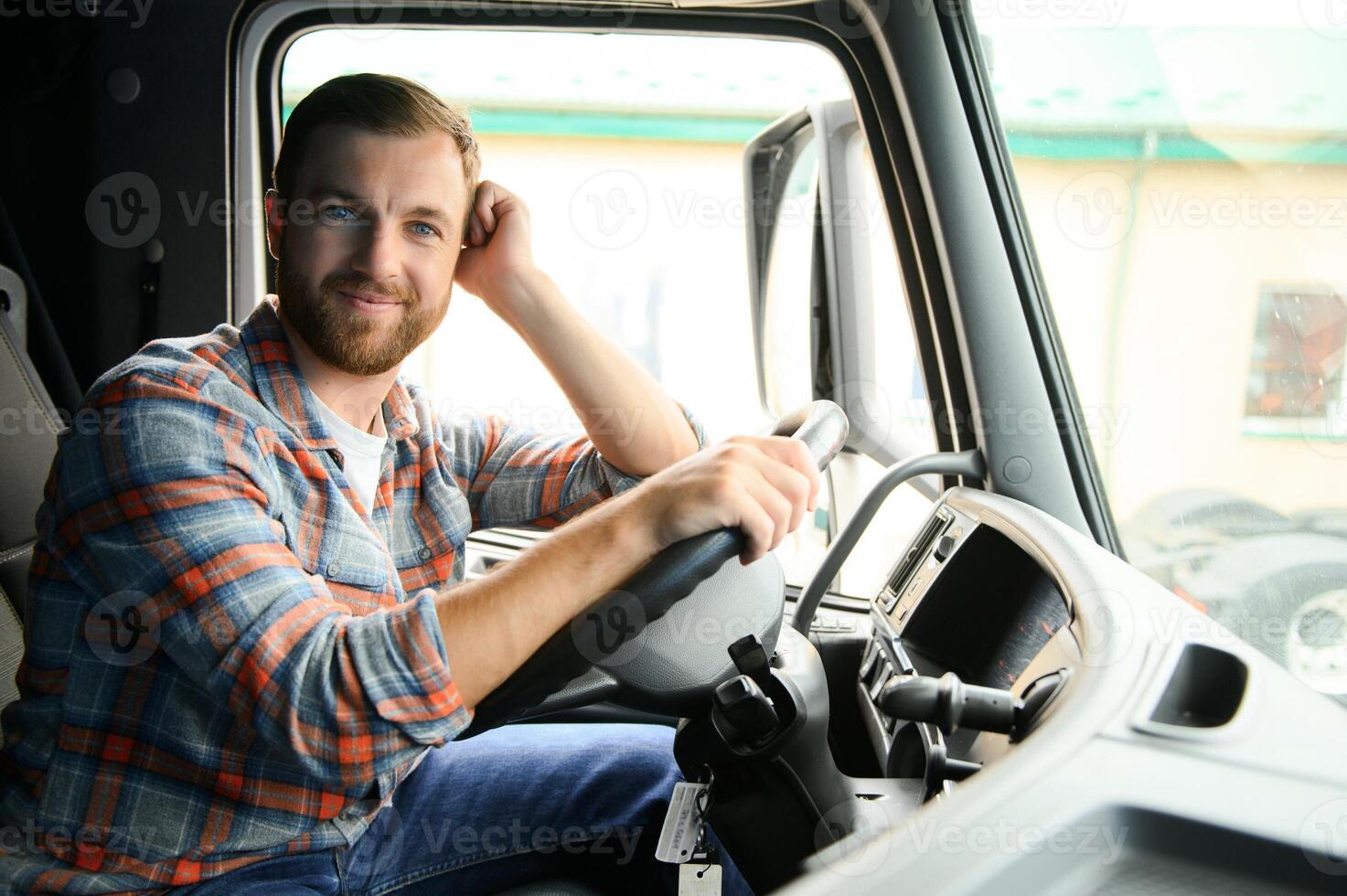 driver behind the wheel in truck cabin photo