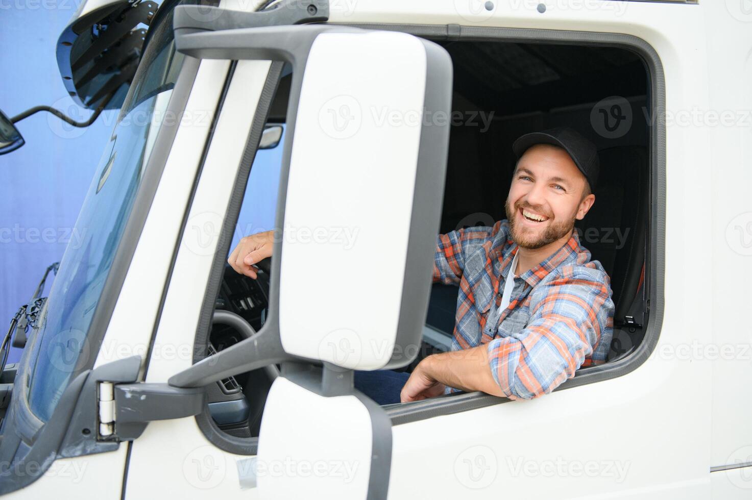 Close up of truck driver behind steering wheel. Copy space. photo