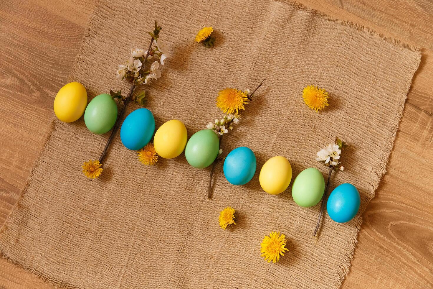Paint eggs for Easter, bright Easter holiday, children paint eggs, colored eggs in a basket, colored eggs on a stand, Holiday background photo