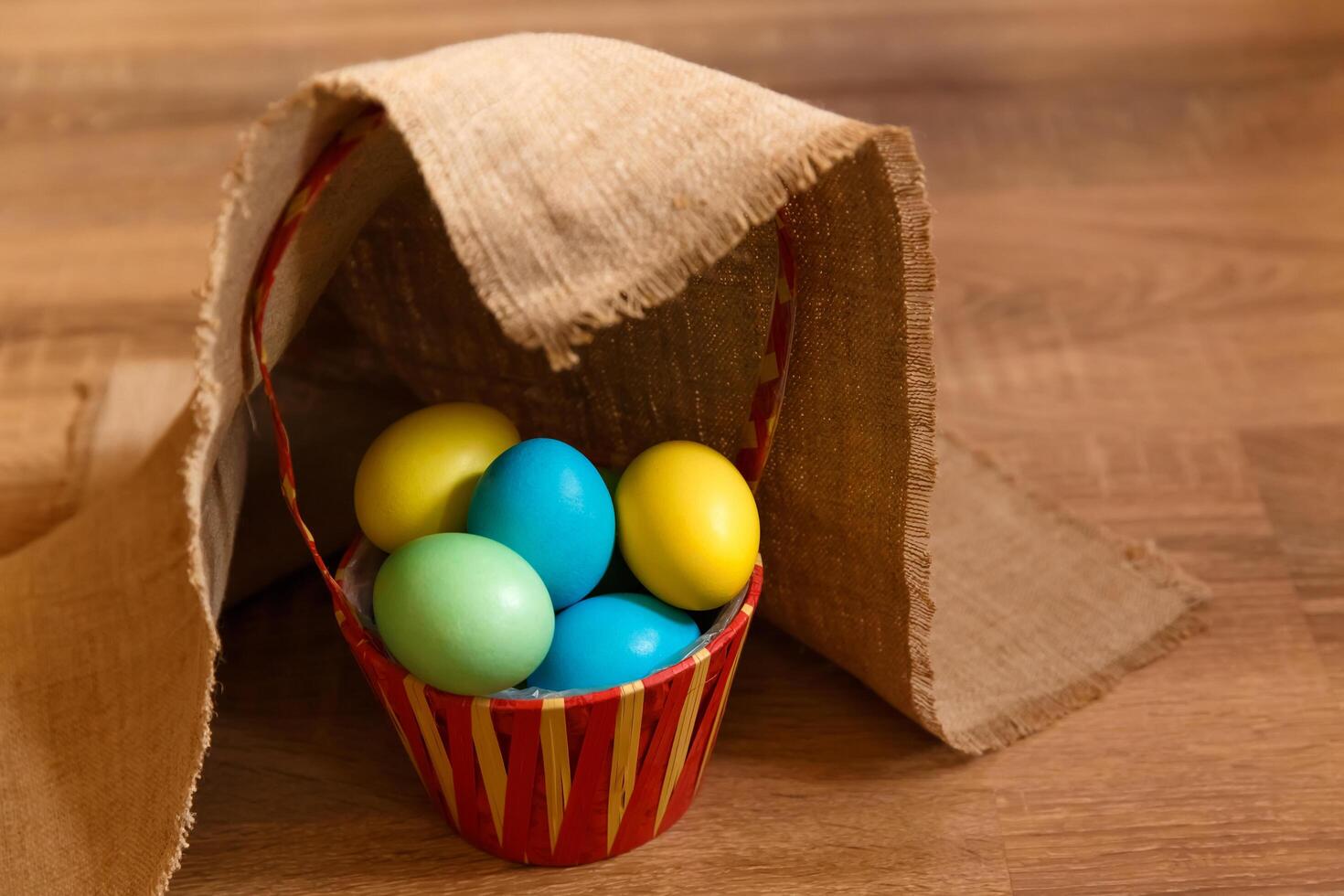 Paint eggs for Easter, bright Easter holiday, children paint eggs, colored eggs in a basket, colored eggs on a stand, Holiday background photo