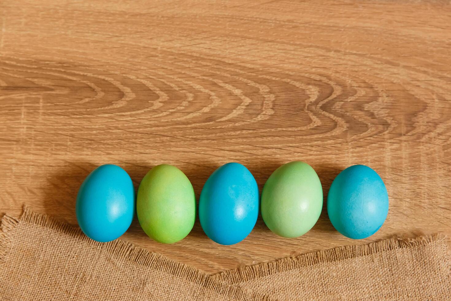 Paint eggs for Easter, bright Easter holiday, children paint eggs, colored eggs in a basket, colored eggs on a stand, Holiday background photo