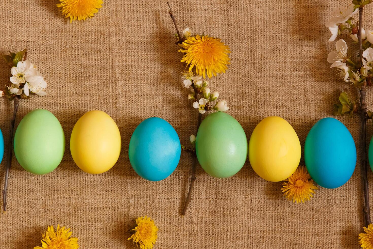 Paint eggs for Easter, bright Easter holiday, children paint eggs, colored eggs in a basket, colored eggs on a stand, Holiday background photo