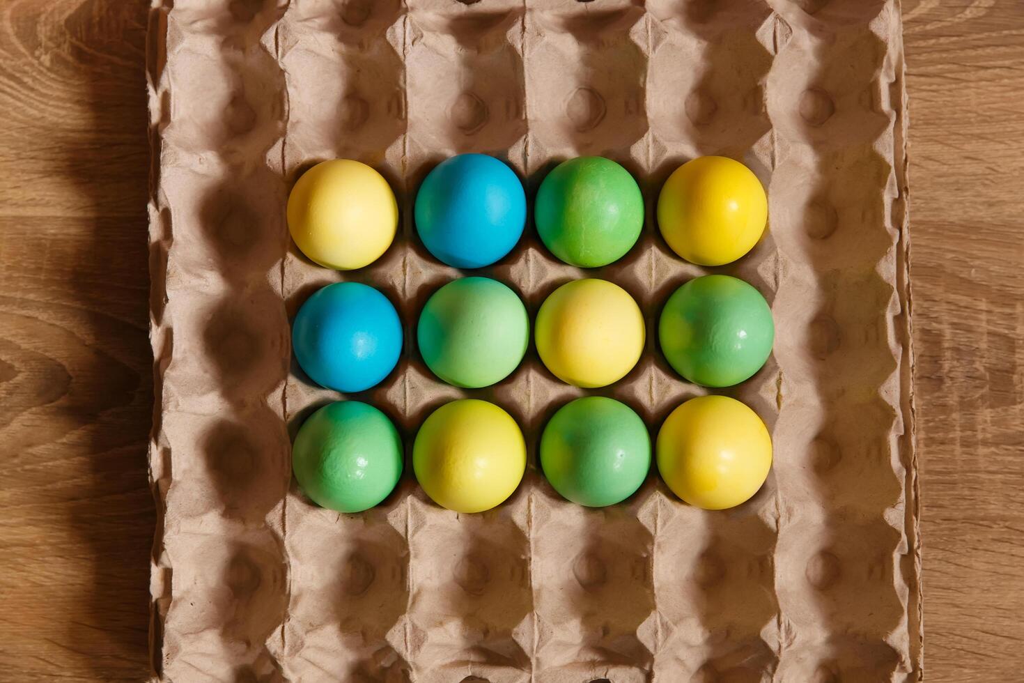 Paint eggs for Easter, bright Easter holiday, children paint eggs, colored eggs in a basket, colored eggs on a stand, Holiday background photo