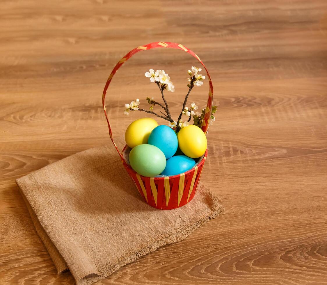 Paint eggs for Easter, bright Easter holiday, children paint eggs, colored eggs in a basket, colored eggs on a stand, Holiday background photo