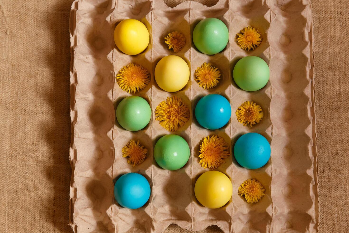 Paint eggs for Easter, bright Easter holiday, children paint eggs, colored eggs in a basket, colored eggs on a stand, Holiday background photo