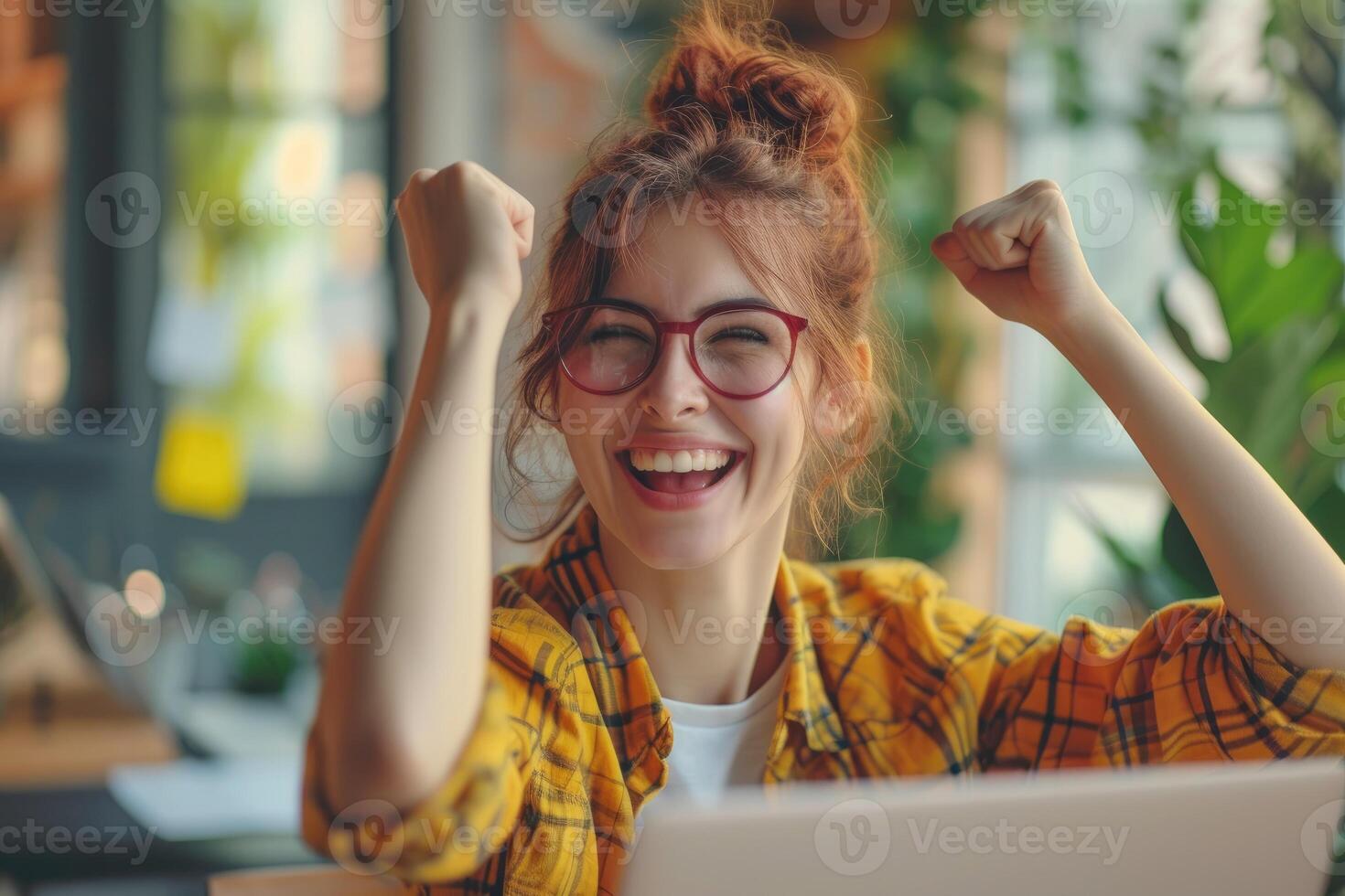 AI generated A happy woman sits in front of her laptop and cheers with raised fists photo