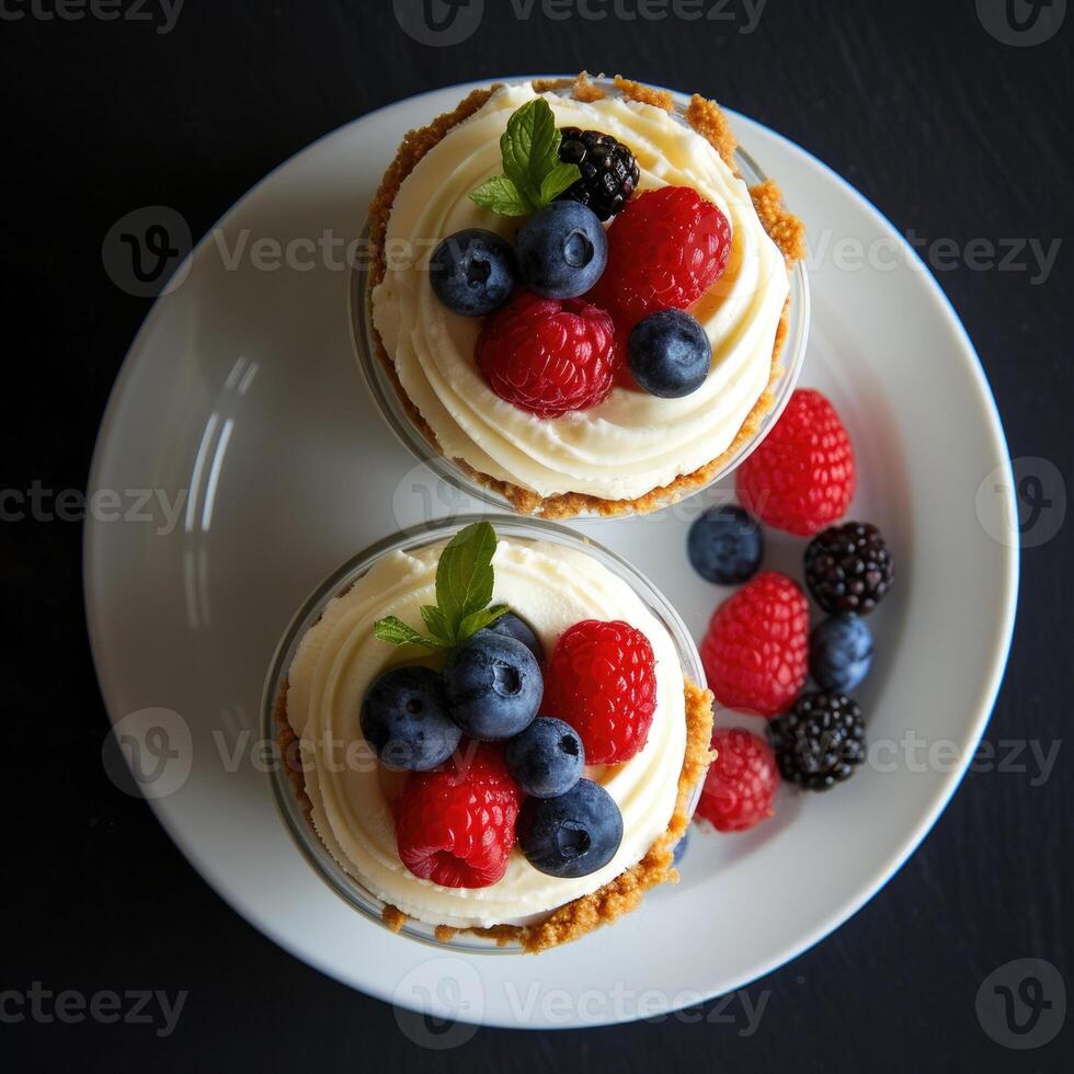 AI generated Top view of two desserts with fresh berries on top and on the plate photo