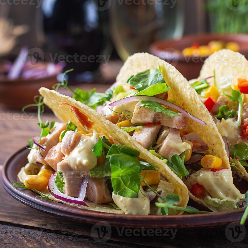 Mexican tacos with chicken meat, corn and salsa. Healthy tacos. Diet menu. Mexican taco. photo