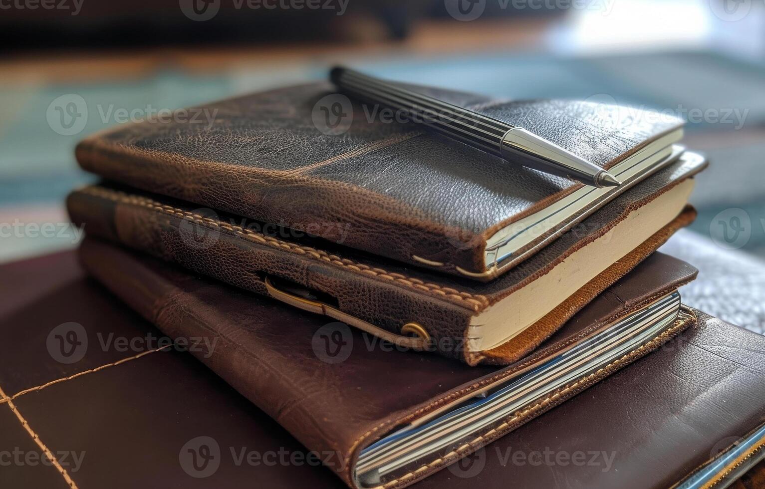 AI generated Three leather journals and pen on top of each other photo