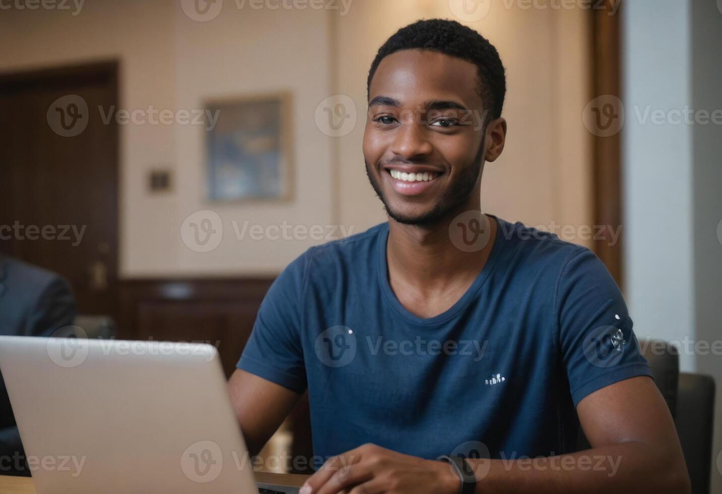 AI Generated A man concentrates on his laptop work in a cozy home setting. His casual attire and demeanor suggest a relaxed work style. photo