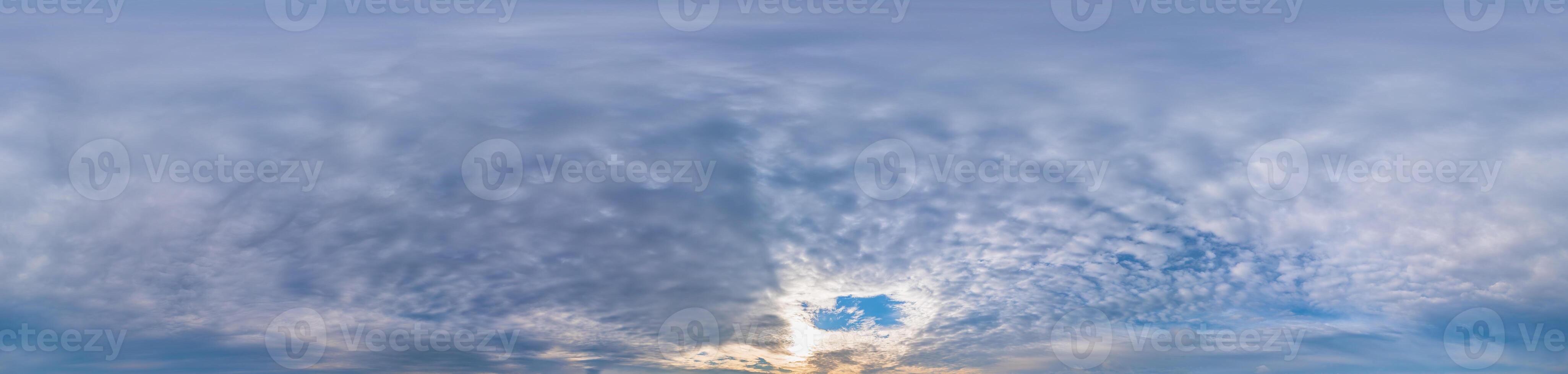 Sunset sky panorama with Stratocumulus clouds in Seamless spherical equirectangular format. Full zenith for use in 3D graphics, game and editing aerial drone 360 degree panoramas for sky replacement. photo