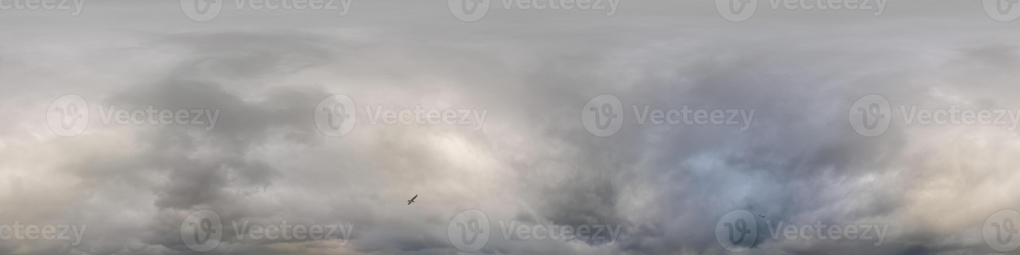 Sky panorama on overcast rainy day with low clouds in seamless spherical equirectangular format. Complete zenith for use in 3D graphics, game and for aerial drone 360 degree panorama as a sky dome photo