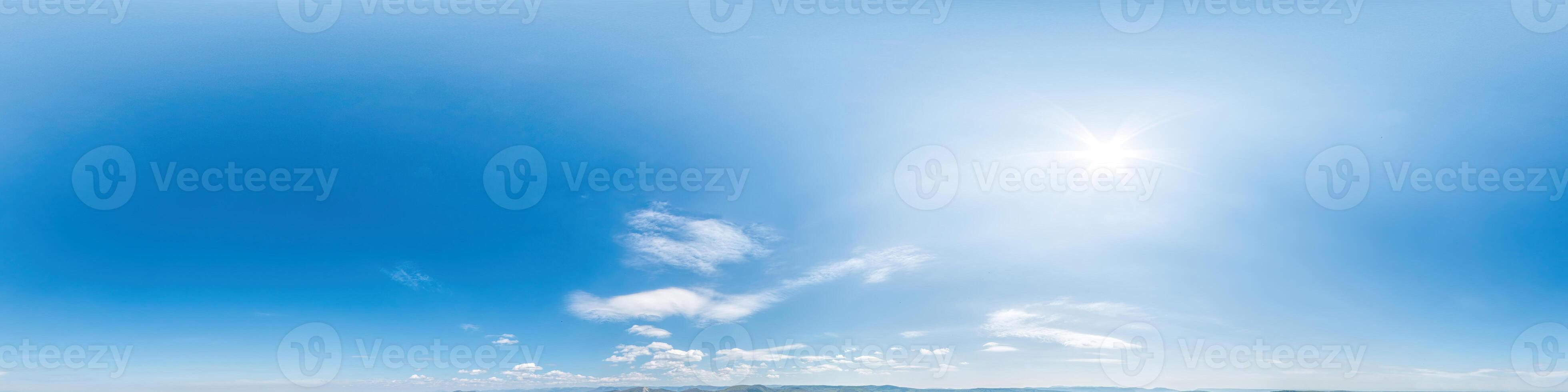 Seamless panorama of sky with light clouds in spherical equirectangular format with complete zenith for use in 3D graphics, game and for composites in aerial drone 360 degree panoramas as a sky dome. photo