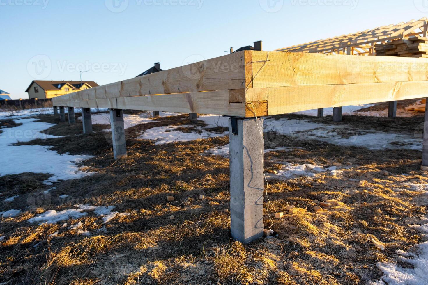 The foundation of a wooden frame house on stilts is a construction site, the process of building a frame photo